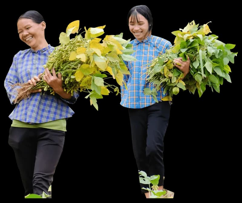 Two growers with their harvest, pictured by Hanuti